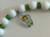 Teeth Obsessed dental charms for Stanley cups, decorative tumbler toppers featuring tooth-themed designs on a clear cup.