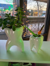 Ceramic molar-shaped vase from Teeth Obsessed, decorative dental-themed ceramic vase for floral arrangements or display.