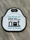 Teeth Obsessed insulated dental lunch bag with tooth-themed design in a tote style, perfect for carrying kids' lunch.