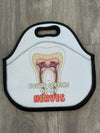 Teeth Obsessed insulated tooth-themed lunch bag tote with colorful dental design and carrying handles for lunch or snacks.
