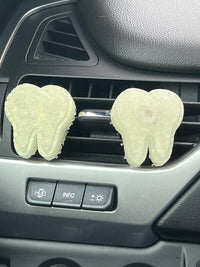 Teeth Obsessed Tooth Car Air Freshener, vent freshies and melts, showing a colorful package with teeth-themed design for fresh car scent.