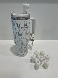 Teeth Obsessed molar tooth straw topper placed on a clear tumbler, featuring detailed molar tooth design for dental-themed drinks.