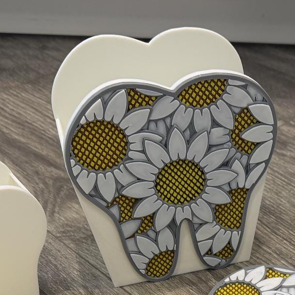 Teeth Obsessed dental vase notepad holder magnet featuring a tooth-shaped design, perfect for organizing notes on a magnetic surface.