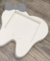 Teeth Obsessed dental vase notepad holder magnet featuring a ceramic design with a tooth motif, ideal for desk organization.