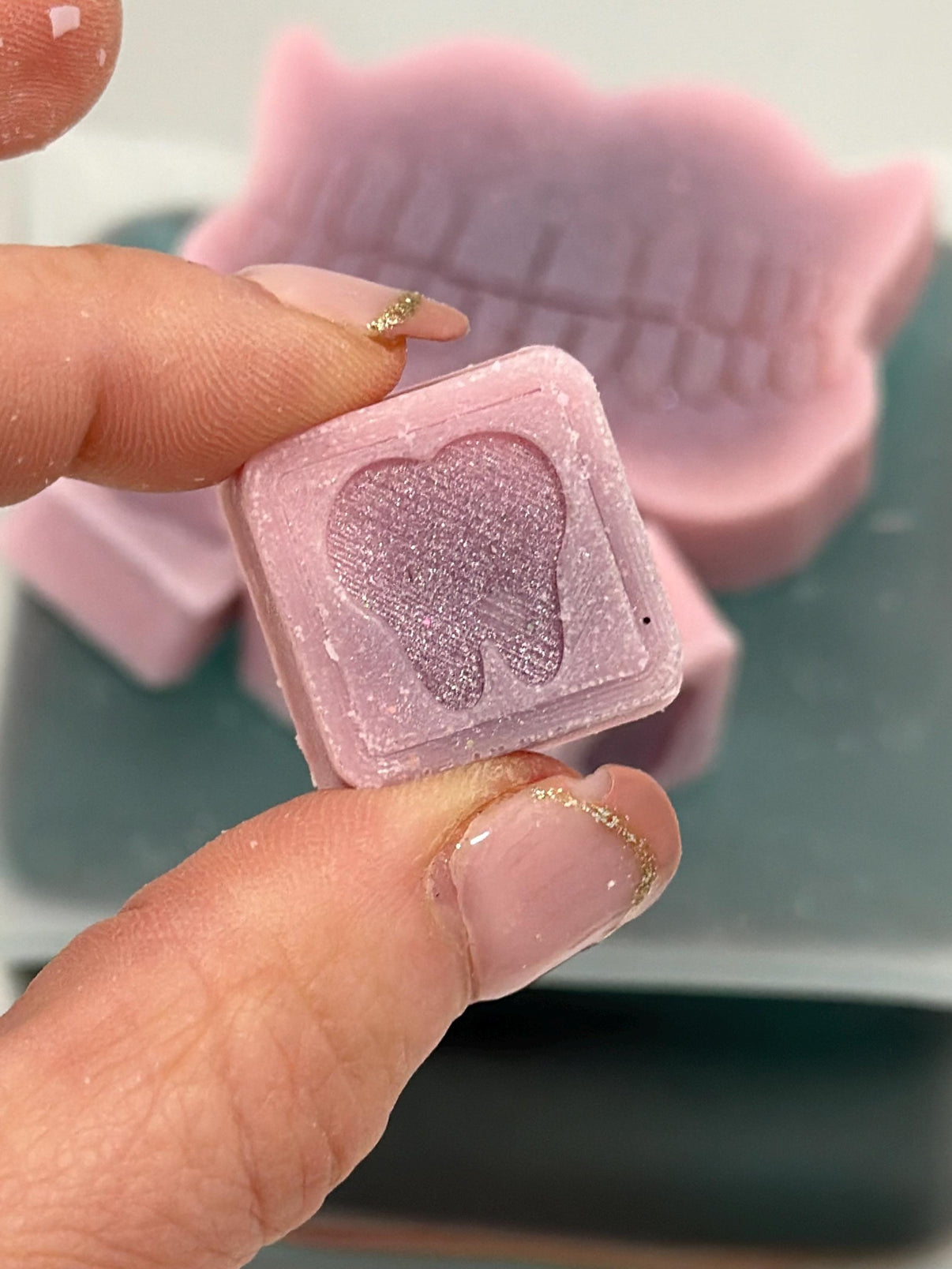 Teeth Obsessed Tooth Wax Melts Freshies in a container, designed for vents and air freshening, with colorful wax pieces visible.