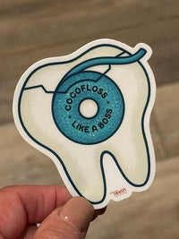 Teeth Obsessed CocoBoss Dental Sticker featuring a colorful, playful design on a white background.