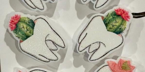 Dental earrings shaped like succulent teeth, stylish and unique jewelry from Teeth Obsessed featuring detailed succulent tooth design.