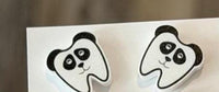 Set of Teeth Obsessed dental earrings featuring panda, sloth, giraffe, and zebra tooth designs on silver hooks.