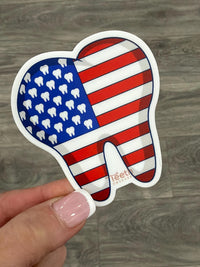 Decorative dental flag teeth stickers featuring 4th of July designs, perfect for dental-themed celebrations or patriotic smiles.