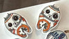 Galaxy Dental Earrings by Teeth Obsessed featuring celestial-themed dental jewelry on a white background.