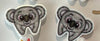 Llama, koala, and cow dental earrings by Teeth Obsessed featuring colorful animal-shaped tooth jewelry on a white background.