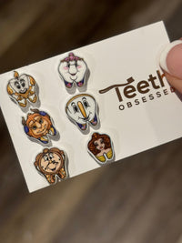 Princess and Friends Dental Earrings by Teeth Obsessed featuring charming character earrings with tooth and princess designs.