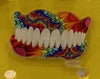 Gold Teeth Obsessed bag charm featuring an orthodontic tooth, nerve, denture, and tooth design, perfect for accessories and bags.