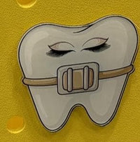 Teeth Obsessed gold bag charm featuring an orthodontic tooth, nerves, denture, and tooth design for charms and pins collection.