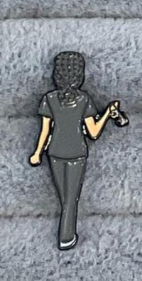 Mrs. Flossy enamel dental pin featuring a tooth and molar design, perfect as jewelry or charm from Teeth Obsessed.