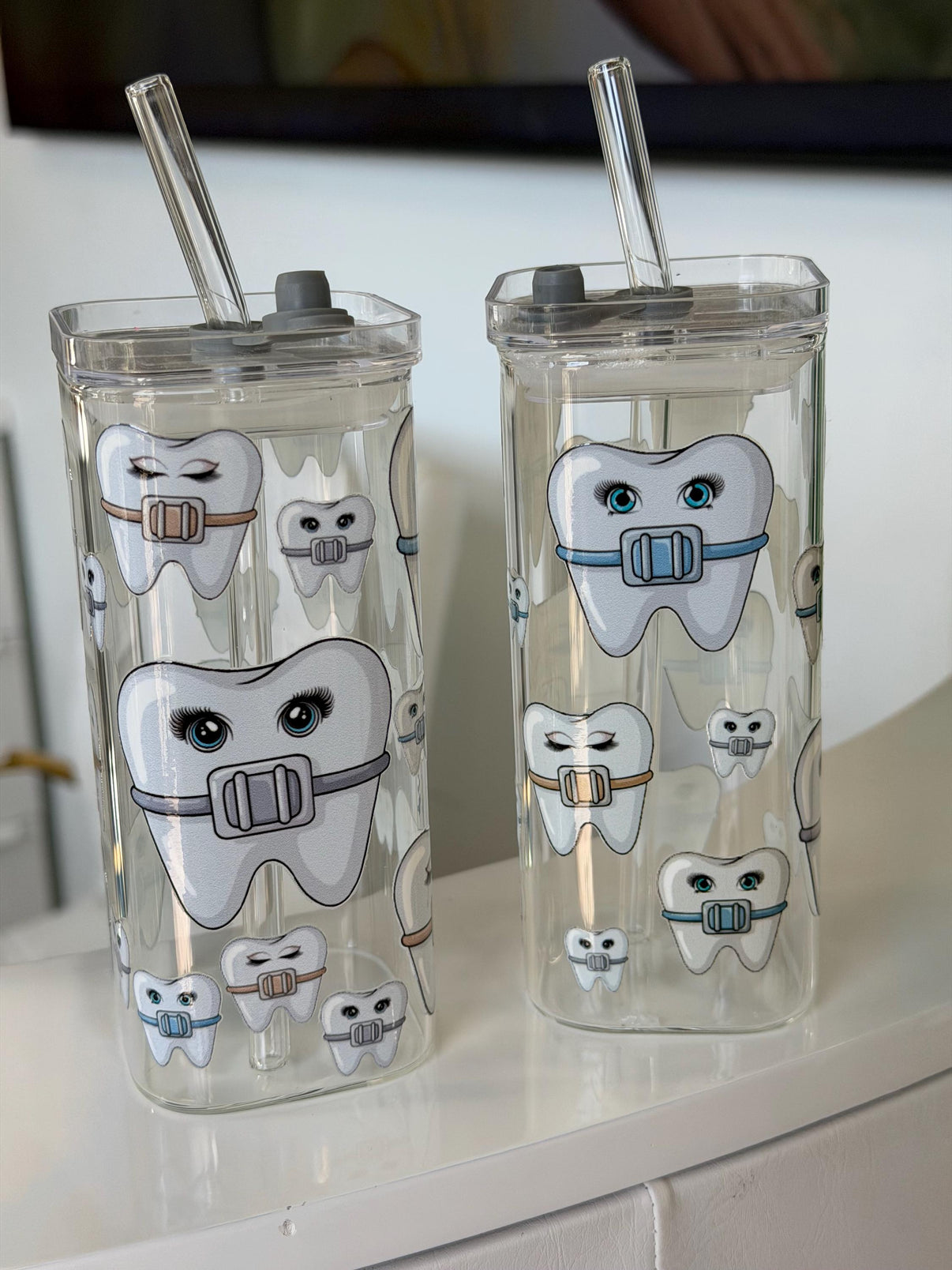 Ortho Tooth Glass by Teeth Obsessed, a clear tumbler featuring dental-themed design for oral health enthusiasts.