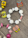 Teeth Obsessed rabbit sponge drinkware charm attached to a cup or tumbler, adding a playful decorative touch.