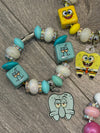 Teeth Obsessed rabbit sponge drinkware charm on a cup or tumbler, featuring a playful, colorful design and textured surface.