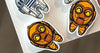 Space Tooth Earrings by Teeth Obsessed featuring dental-themed earrings with spaceship and tooth design on a white background.