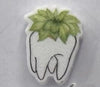 Teeth Obsessed succulent tooth earrings featuring small, detailed dental-themed jewelry with a green succulent design.