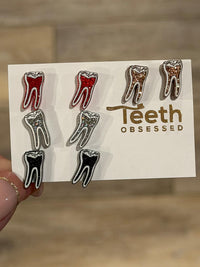 Black RCT Dental Earrings by Teeth Obsessed featuring realistic tooth-shaped dental jewelry on posts.