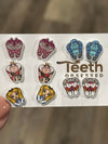 Teeth Obsessed Wonderland Dental Earrings featuring playful cat-shaped dental jewelry with detailed tooth design.