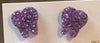 Dark purple dental earrings by Teeth Obsessed featuring tooth-shaped charms with purple enamel finish.