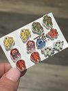 Pair of Nautica Tooth Earrings by Teeth Obsessed featuring large turtle-shaped dental earrings with a nautical theme.