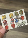 Large Nautica-themed dental earrings by Teeth Obsessed featuring turtle-shaped tooth designs on silver hooks.