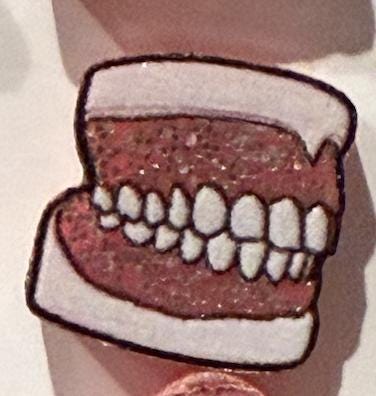 Pink glitter dental earrings featuring molar, denture, and typodont designs from Teeth Obsessed, showcasing detailed tooth and denture models.