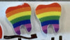 Rainbow Tooth Earrings by Teeth Obsessed, colorful dental jewelry featuring vibrant rainbow tooth designs.