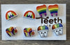 Rainbow Tooth Earrings by Teeth Obsessed featuring colorful dental-themed earrings with a playful tooth design