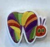 Rainbow glitter tooth earrings by Teeth Obsessed featuring colorful tooth-shaped dental jewelry with sparkling rainbow accents.