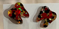 Red and gold dental earrings by Teeth Obsessed featuring tooth-shaped charms with vibrant red and gold accents.