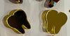 Red and gold dental earrings by Teeth Obsessed, featuring tooth-shaped jewelry with vibrant red and gold accents.