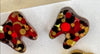 Red glitter dental earrings by Teeth Obsessed featuring tooth-shaped charms with vibrant red color and shiny finish.