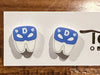 Red superhero tooth-shaped earrings by Teeth Obsessed, featuring playful dental-themed design for fun and stylish accessory.