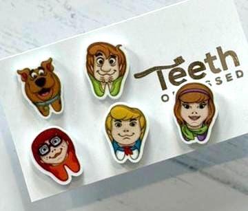Scooby Tooth Earrings by Teeth Obsessed featuring playful dental-themed earrings with Scooby-Doo style teeth design.