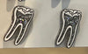 Silver RCT Tooth Earrings by Teeth Obsessed featuring detailed dental tooth designs, perfect for dental enthusiasts.