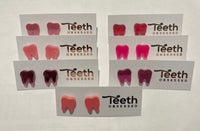 Pink glitter dental stud earrings featuring tooth shapes from Teeth Obsessed, perfect for a fun, bold accessory.