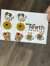Teeth Obsessed sunflower tooth earrings, dental assistant gift, gold-tone dental earrings with sunflower and tooth design.