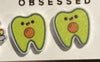 Teeth Obsessed Taco and Avocado Tooth Earrings, dental jewelry featuring playful taco and avocado designs on silver hooks.