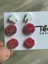 Pink molar, smile, and white tooth dental earrings by Teeth Obsessed, featuring colorful, playful dental jewelry for pierced ears.