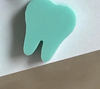 Teeth Obsessed teal whale dental earrings in dark or light teal color, featuring playful whale-shaped designs for dental enthusiasts.