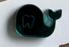 Teeth Obsessed teal whale dental earrings in dark and light teal, featuring playful whale-shaped designs for dental accessory fashion.