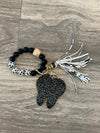Set of dental keychains featuring a cow, cheetah, and brown leopard tooth designs from Teeth Obsessed.