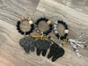Set of dental keychains featuring cow, cheetah, and brown leopard tooth designs by Teeth Obsessed.