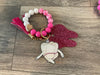 Mrs Flossy and Friends dental keychain by Teeth Obsessed featuring a cute flossing character and a tooth-shaped charm.