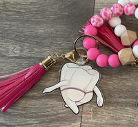 Mrs Flossy and Friends dental keychain by Teeth Obsessed featuring Flossy and a tooth charm on a colorful keyring.