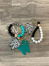 Leopard print pink and teal dental keychains featuring teeth design from Teeth Obsessed, perfect for keys or accessories.